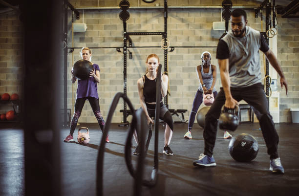 istock Small Group of People Exercising in a Gym 1145612955