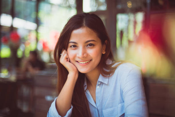 istock Asian woman in cafe drinking coffee 1145613898