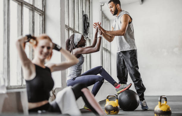 istock Group of Young People in a Gym 1145614087