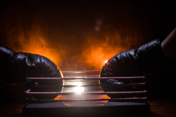 istock Empty boxing ring with red ropes for match in the stadium arena. Creative artwork decoration 1145614261