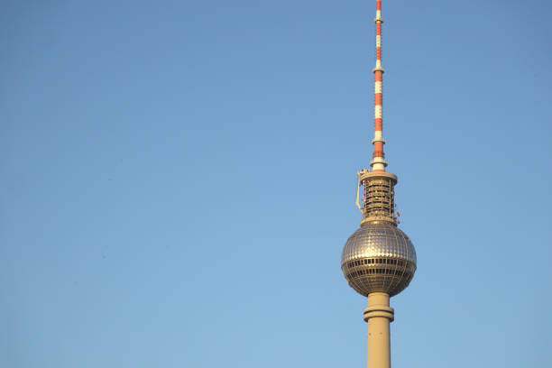 LOW ANGLE VIEW OF COMMUNICATIONS TOWER AGAINST SKY