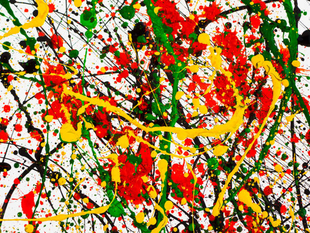 istock splashes on red and black and green and yellow paint 1145619863