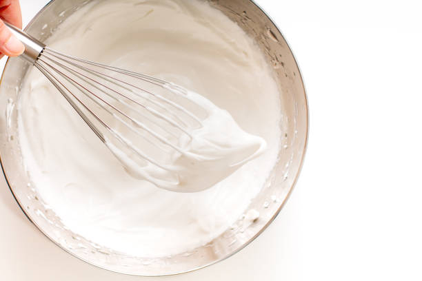 istock Baking bakery concept whipped eggs for homemade sponge cake on white background 1145622487