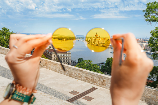 Budapest city view through yellow hipster sunglasses