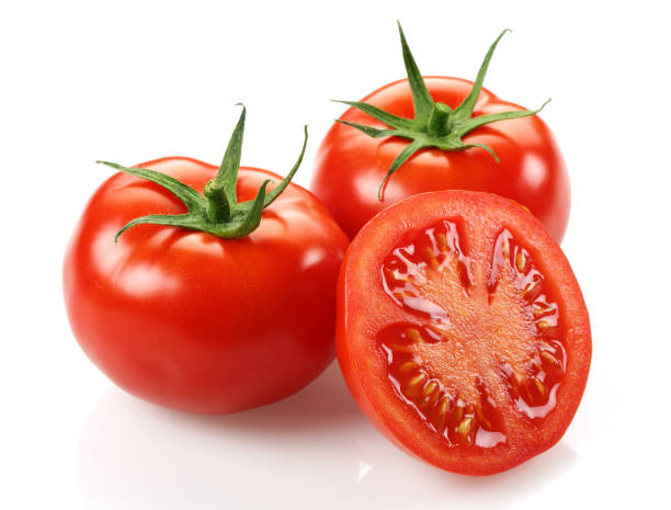 istock Whole and half tomatoes isolated on white 1145623682