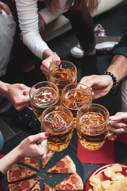 istock Happy group of friends drinking beer 1145623914