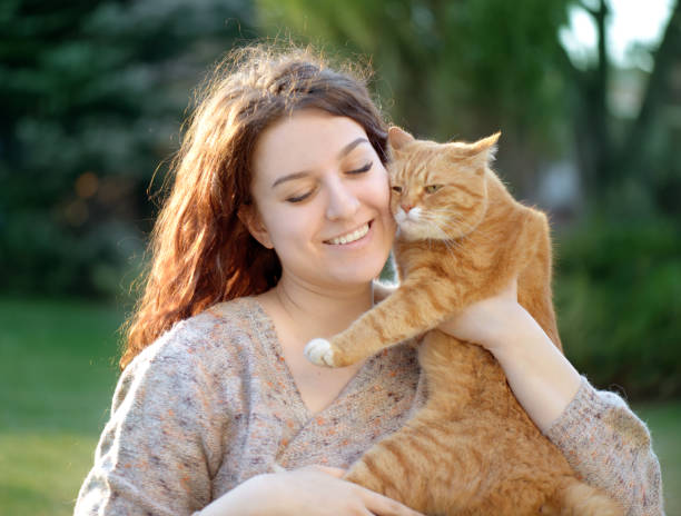 istock Woman and Cat ( summer) 1145623982