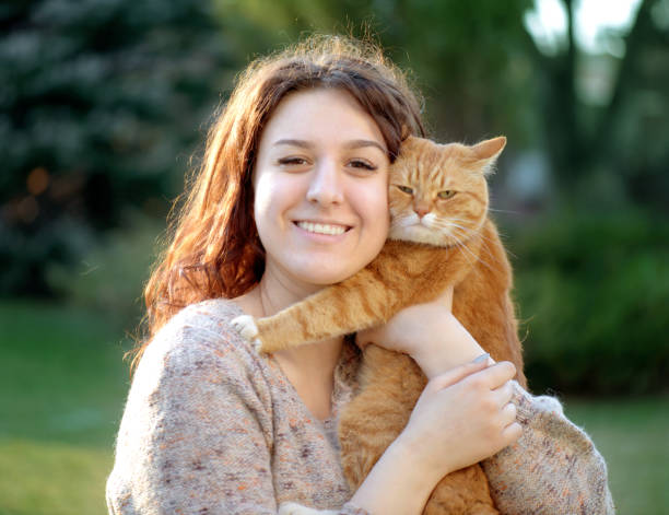 istock Woman and Cat ( summer) 1145625019