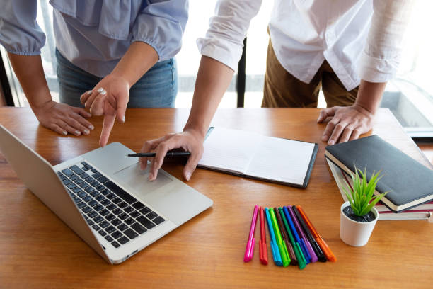 istock Group of young people learning studying lesson in library during helping teaching friend education prepare for exam, youth campus friendship teenager teens concept 1145625095