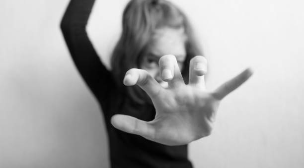 istock Little girl protects herself with her hand 1145629227