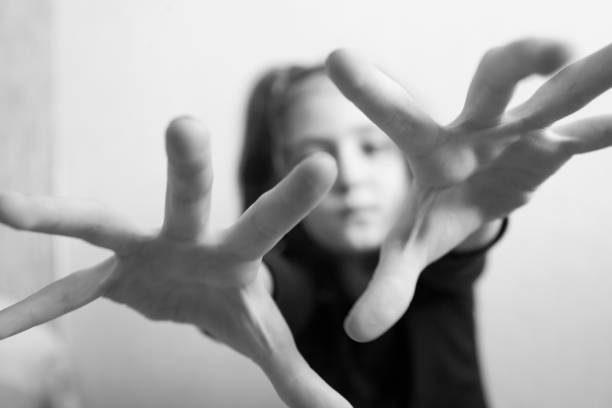istock Little girl protects herself with her hand 1145629253