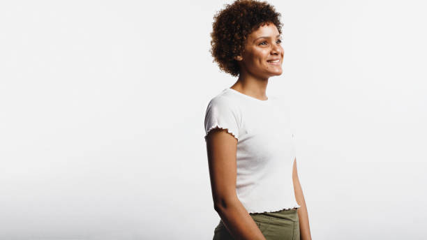 istock Happy young woman with curly hair 1145629596