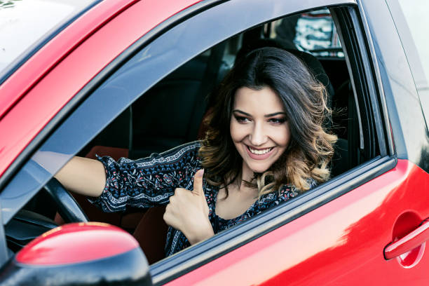 istock Beautiful Woman in the Car 1145629663