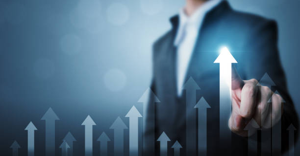 Business development to success and growing growth concept. Businessman pointing arrow graph corporate future growth plan and increase percentage Business development to success and growing growth concept. Businessman pointing arrow graph corporate future growth plan super money stock pictures, royalty-free photos & images