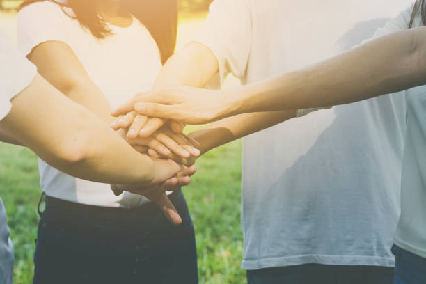 istock Team teamwork business join hand together concept, Power of volunteer charity work, Stack of people hand 1145632368
