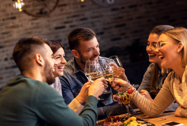 istock Group of young friends having fun in restaurant. 1145634754