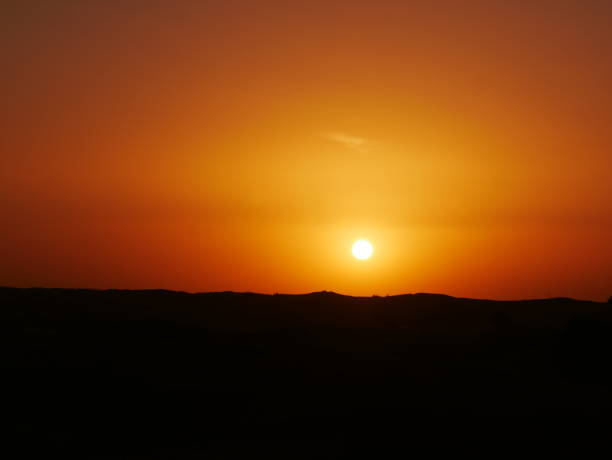 istock African sunset in the savannah in rich orange 1145634903