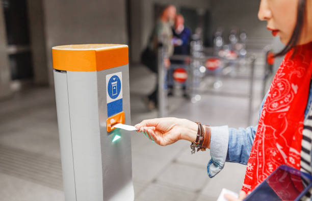 istock Validate a ticket at a validation machine for access to the underground city transport system 1145634918