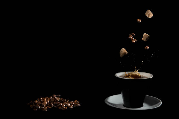 istock Coffee with coffee beans and cane sugar on a dark background. 1145635206