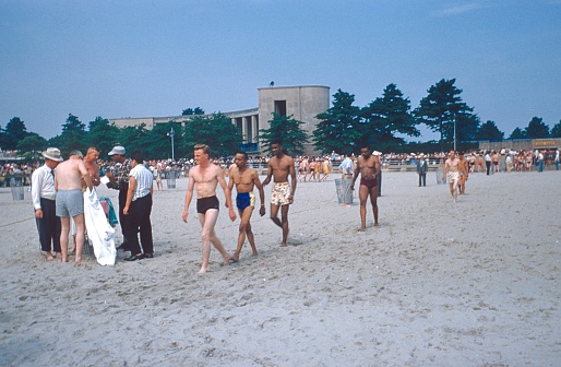 Orchard Beach, Bronx, New York City, NY, USA, 1958. New members of the Jehovah's Witness congregation begin baptism at Orchard Beach.