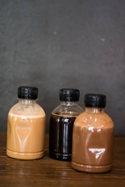 istock Three of plastic coffee bottle on wood table 1145639719
