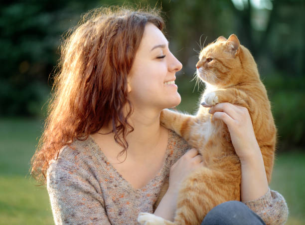 istock Woman and Cat ( summer) 1145641589