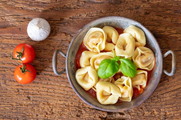 istock tortellini on wood with tomato sauce 1145645259