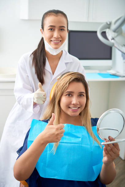 istock Dentist and patient showing thumbs-up 1145647172