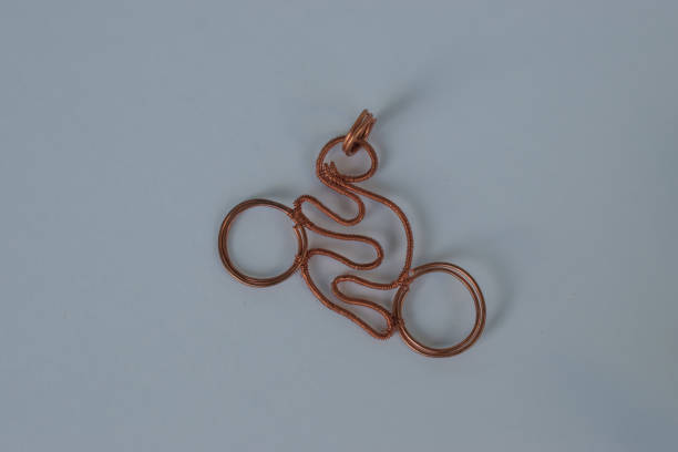 istock Motorcycle. Unique handmade jewelry made of copper wire. 1145647861