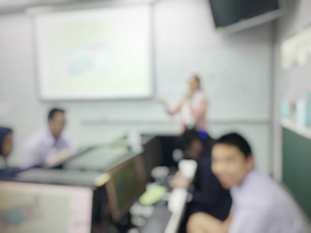 istock Blurred image of group of students are learning and sitting at desk using computer lap together in classroom for study and workshop in computers room at secondary school. education technology concept. 1145650681