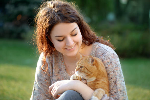 istock Woman and Cat ( summer) 1145651689