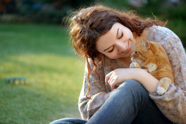 istock Woman and Cat ( summer) 1145652620