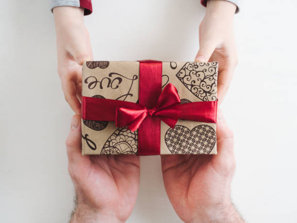 istock Child congratulates his Father. Beautiful gift box 1145652694