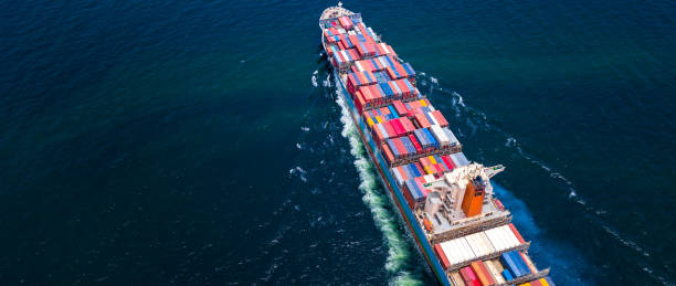 istock Cargo ships with full container receipts to import and export products worldwide 1145653933