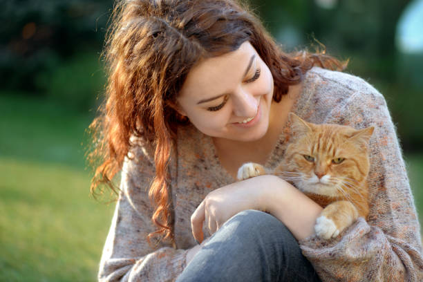 istock Woman and Cat ( summer) 1145654092
