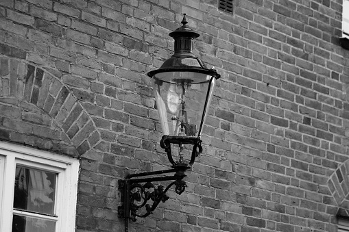 old lamp at a hous wall