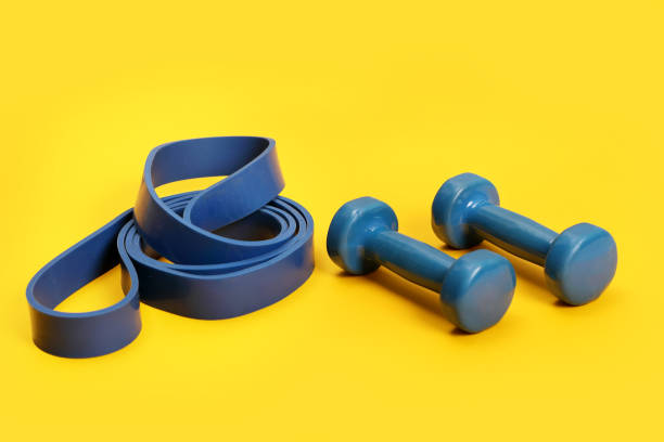 Dumbbells and rubber band for fitness . stock photo
