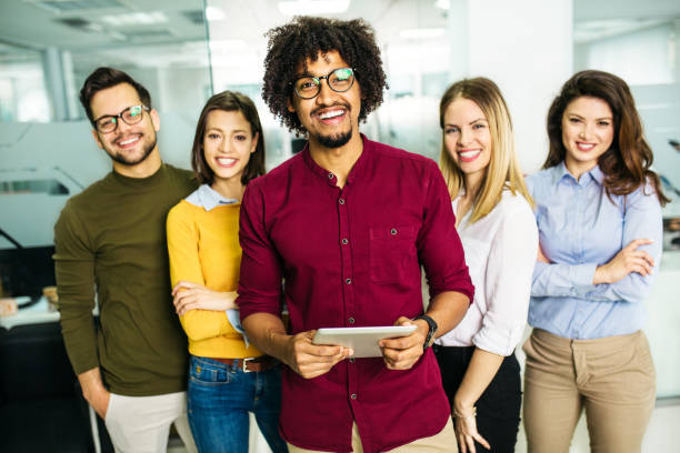 istock Happy and cheerful young students standing and looking at camera 1145655705
