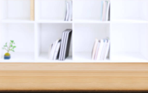 istock Selected focus empty old wooden table and Library or Bookstore blur background with bokeh image. for your photomontage or product display 1145655851