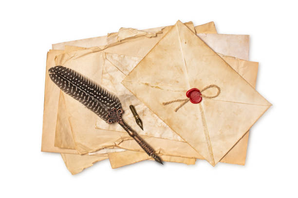 istock Vintage composition with yellowed letters in envelope and luxury quill pen 1145656081
