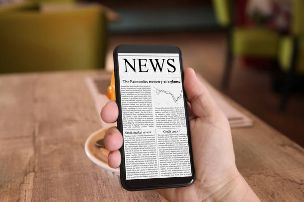 istock Latest internet news newspaper mobile phone 1145657156