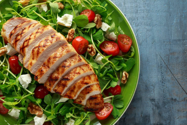 istock Fresh Grilled Chicken salad with tomatoes, feta cheese 1145657265