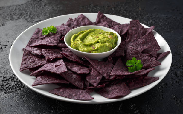 istock Blue corn Organic tortilla chips with Guacamole 1145658343