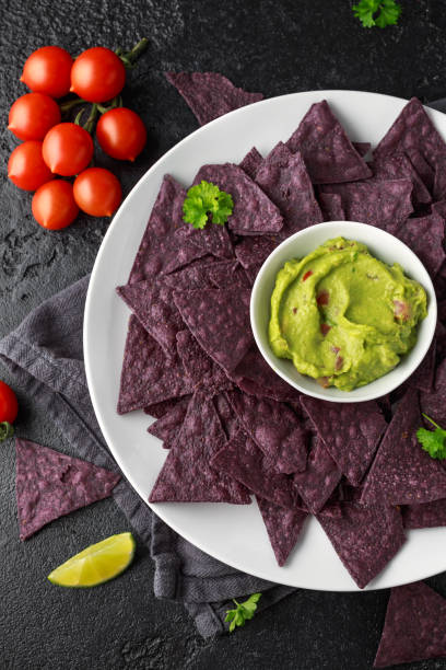 istock Blue corn Organic tortilla chips with Guacamole 1145658405