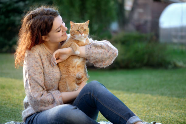 istock Woman and Cat ( summer) 1145658946