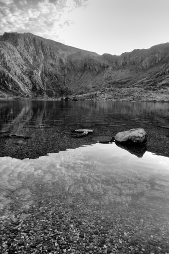 Mountain lake black and white vertical, reflections of sky