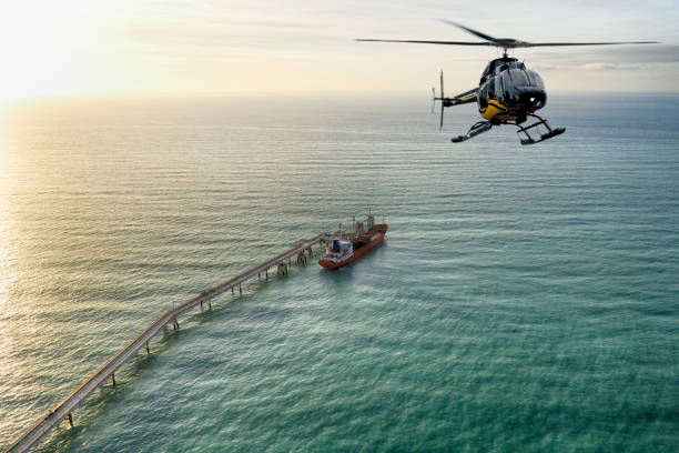 istock Helicopter flying over industrial ship. 1145660279