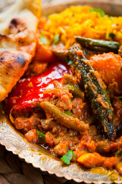 istock Indian Authentic Traditional Vegetable Curry with Saffron Basmati Rice and Naan Bread 1145660650