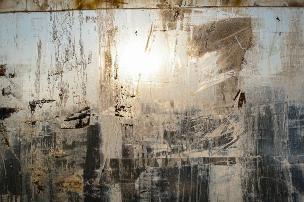 istock Abstract background. Window chaotically smeared with paint, illuminated by the sun. 1145661566