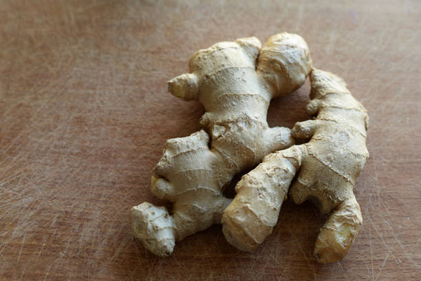 istock ginger plant product on wooden background 1145661887